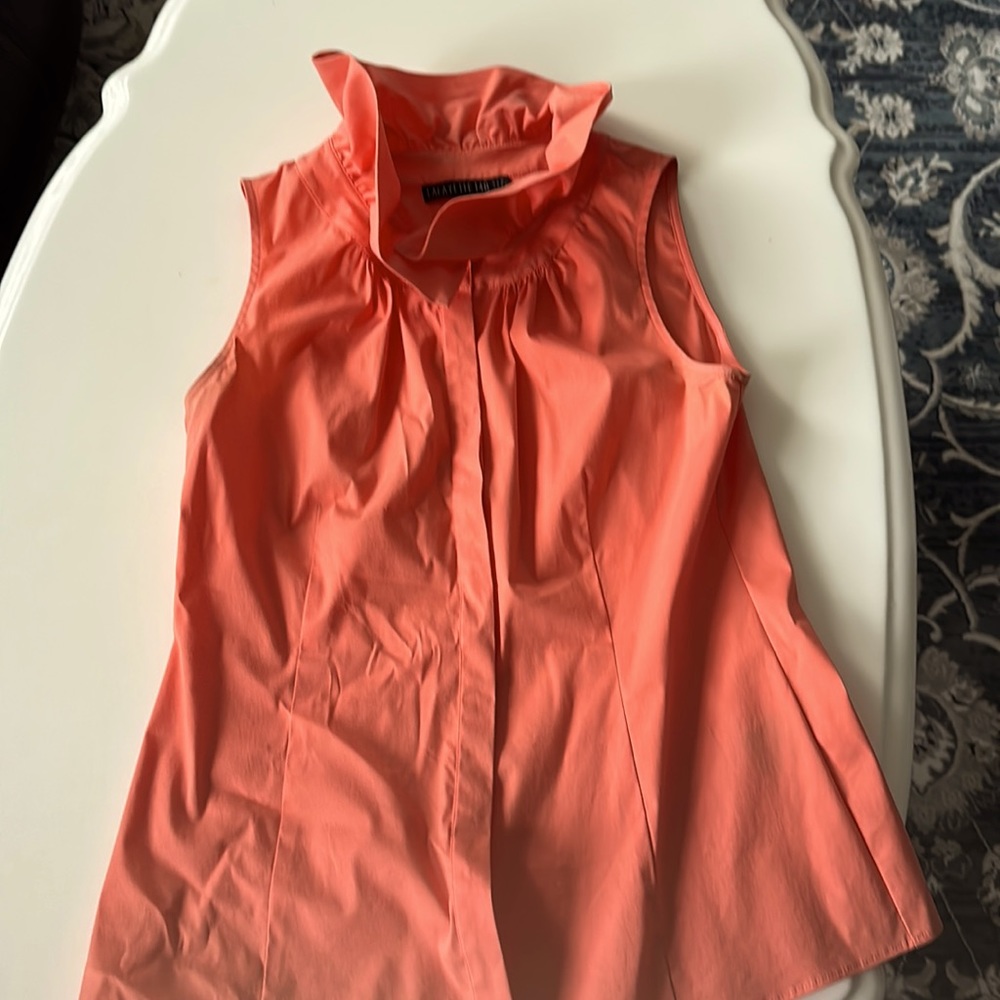Rifle neck sleeveless top. Wear it under suit or with jeans